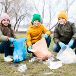 Kids playing their role in waste management by cleaning the surroundings